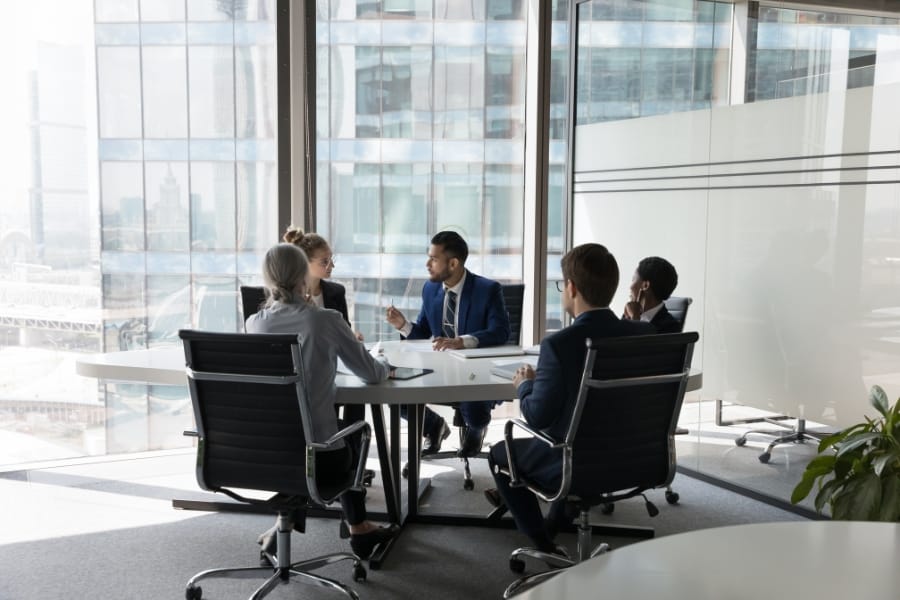 A meeting where people discuss AI coaching