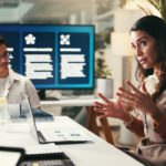 Improve Coaching effectiveness: Business coach leading a discussion in a meeting room focused on improving coaching effectiveness