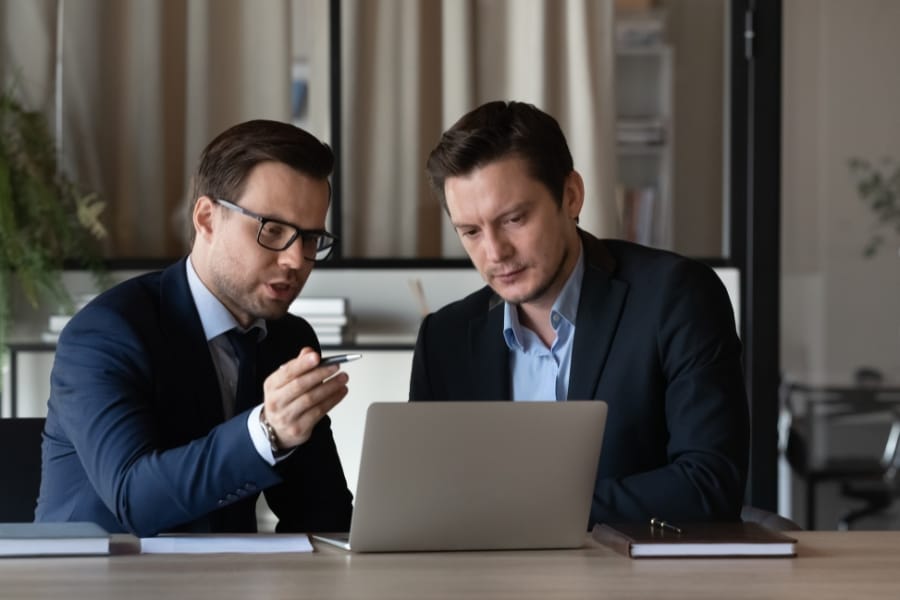 Two people debrief about life sciences sales coaching
